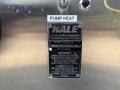 1999 Freightliner FL80 truck with a Hale pump heat label and warning information on the side showing specifications and lubrication instructions