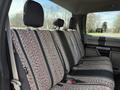 A 2018 Ford F-150 with a back seat featuring patterned fabric upholstery in gray and black