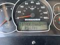 A vehicle's dashboard displaying the odometer reading of 148806.8 kilometers and an instantaneous fuel consumption of 2.5 liters per hour