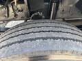 Close-up of a tire from a 2011 Workhorse W62 showing tread patterns and wear on the surface