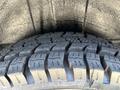 Close-up of a tire tread on a 2019 Mercedes-Benz Sprinter showing deep grooves and a rugged pattern designed for traction and stability