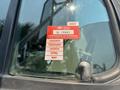 A red and white vehicle inspection sticker is visible on the window of a 2006 Sterling Acterra displaying the certificate of approval and the months listed from January to May