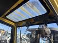 Interior view of a 1993 Hyster H80XL forklift showing the ceiling with a transparent panel and a mounted fan along with control buttons on the side