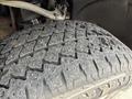 Close-up of a worn tire from a 2019 Chevrolet Silverado 1500 showing the tread pattern and surface details