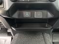 A close-up of the interior console of a 2023 Ford F-450 Super Duty featuring USB and 12V power outlet slots