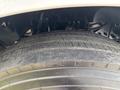 Close-up of a large tire from a 2016 Ford F-750 showcasing its tread pattern and rubber surface details