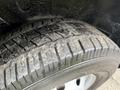 A close-up view of a tire from a 2020 RAM Promaster showing the tread pattern and wear on the rubber