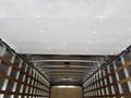 Interior view of a 2022 International MV607 truck showing metal framing and wooden slats along the walls