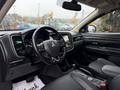 Interior view of a 2016 Mitsubishi Outlander showcasing the steering wheel dashboard and front seats with controls and displays visible