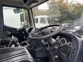 Interior of a 2017 Autocar Xpert featuring two steering wheels and dashboard controls with gauges and buttons
