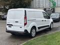 A white 2019 Ford Transit Connect van parked with its rear view visible showcasing its compact design and sliding side door