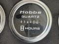 Close-up of a Hobbs hour meter reading 01428 hours on a 2008 International 4300