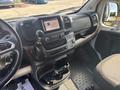 Interior of a 2022 RAM Promaster 350 showing the dashboard gear shift and multimedia controls with a grey front seat and floor mats