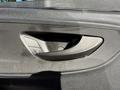 A close-up of a door handle on a 2023 Mercedes-Benz Sprinter 2500 featuring controls for locking and unlocking the door