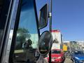 Close-up of the side mirror and window of a 2009 Morgan Olson Workhorse W62 showing the mirror's reflection and the truck's exterior details