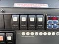 Dashboard controls of a 2020 Mercedes-Benz Sprinter 2500 featuring toggle switches for various features and a digital display showing a number