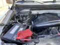 2014 Ford F-150 engine bay with visible battery and wiring components