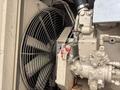 A 2005 Katolight SED60FPJ4 generator featuring a large fan and multiple interconnected components including pipes and valves