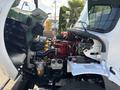 A 2019 Freightliner M2 106 with its hood open revealing the engine and various internal components including hoses and wires