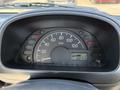 Dashboard of a 2008 Suzuki Carry showing the speedometer and warning lights with a total mileage of 65714 km