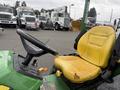 2009 John Deere 2653B Precision Diesel Mower with a worn yellow seat and a control panel visible in the foreground