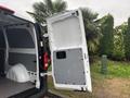 A 2021 Mercedes-Benz Metris with one rear door opened revealing a spacious cargo area designed for transporting goods and equipment