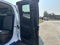 A 2017 Chevrolet Colorado with an open passenger door revealing the interior seating and dashboard details