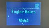 Display screen showing engine hours with the reading 9564 on a dark background