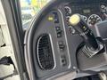 Interior dashboard of a 2013 Freightliner 114SD showing controls for ventilation and driving functions