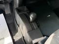 The gear shift lever of a 2016 Chevrolet Silverado 2500HD with markings for 2H 4H and 4L settings