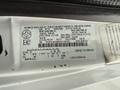 2017 Ford E450 with a vehicle identification number label detailing specifications and capacity information