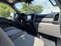 Interior of a 2020 Ford F-350 SD featuring a modern dashboard with a touchscreen display and spacious seating in gray upholstery