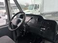 Interior view of a 2012 Ford Econoline with a steering wheel dashboard and controls