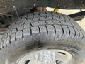 Close-up of a tire from a 2014 Ford F-250 SD showing detailed tread patterns and rim with a five-bolt design