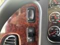 Close-up of the control panel in a 2022 Freightliner M2 106 showing buttons labeled SPD CNTL RSM ACC and CST along with gauges for oil water and transmission pressure