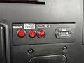 Control panel of a 2020 International MV607 featuring switches for strobe and power as well as a gauge displaying hours of operation