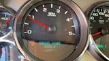 The dashboard of a 2013 Chevrolet Silverado 3500HD showing the RPM gauge and a digital display indicating engine hours at 2206.2