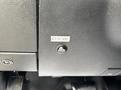 A close-up of a vehicle dashboard featuring a button labeled STROBE located on a textured black panel