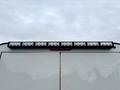 A 2016 RAM 1500 with a light bar mounted on the roof featuring multiple LED lights