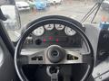The image shows the driver's seat and dashboard of a 2006 E-One Typhoon with gauges and controls visible