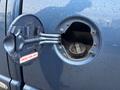 A close-up view of the fuel filler cap of a 2006 Dodge Ram 2500 highlighting the diesel fuel inlet and a label that says DIESEL FUEL ONLY