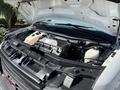 2019 GMC Savana engine compartment with open hood showing the engine components and fluid reservoirs