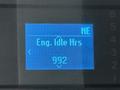 Display screen showing engine idle hours as 992 on a dashboard