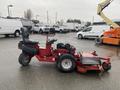 A red 2017 Ferris Rotary lawn mower with a black seat and a side-mounted cutting deck