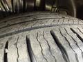 Close-up of a worn tire tread showing prominent grooves and uneven wear on a 2014 Honda Odyssey tire