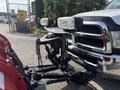 A 2013 RAM 5500 pickup truck equipped with a front-mounted snow plow and dual auxiliary lights