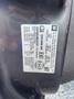 A 2011 Chevrolet Avalanche with a visible identification label displaying vehicle information and specifications
