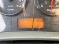 Dashboard of a 2012 International DuraStar 4300 displaying RPM speedometer and hour meter with indicator lights