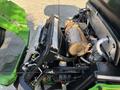 2021 John Deere 1575 engine compartment showing the radiator and other mechanical components