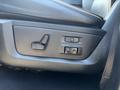 A close-up of the seat adjustment controls for a 2018 RAM 3500 featuring buttons for reclining and driver memory settings